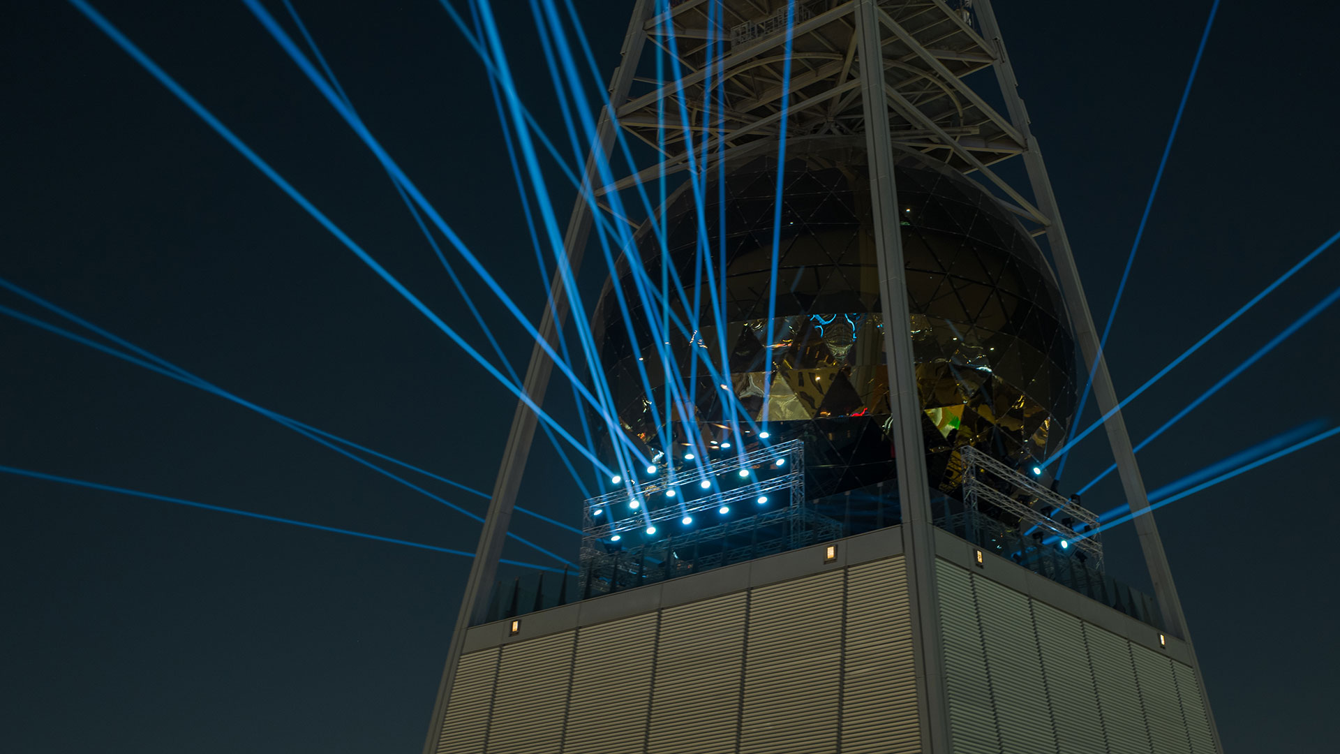 Astrum — blue beams radiating from the top of Al Faisaliah Tower